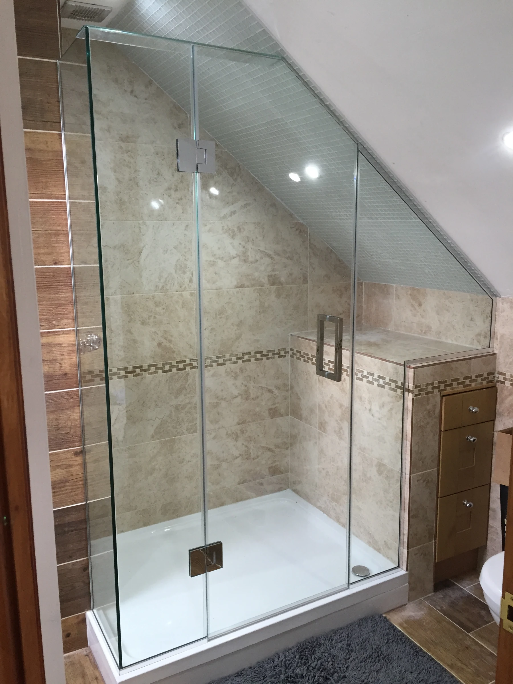 Bespoke frameless glass shower screen design by Lumelle Glass Ltd - 27 years of specialist engineering expertise