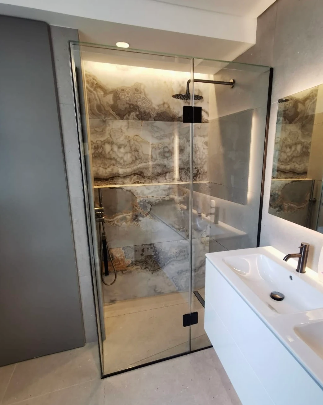 Bespoke frameless glass shower screen design by Lumelle Glass Ltd - 27 years of specialist engineering expertise