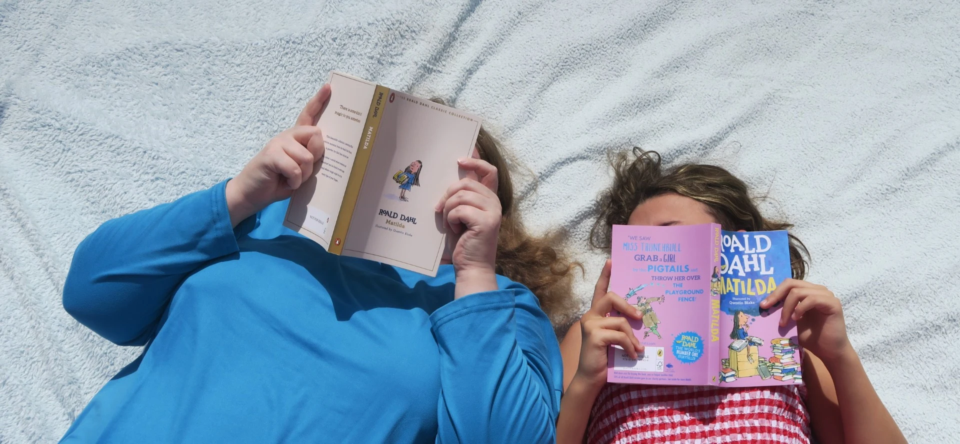 Adult And Child Reading The Same Book