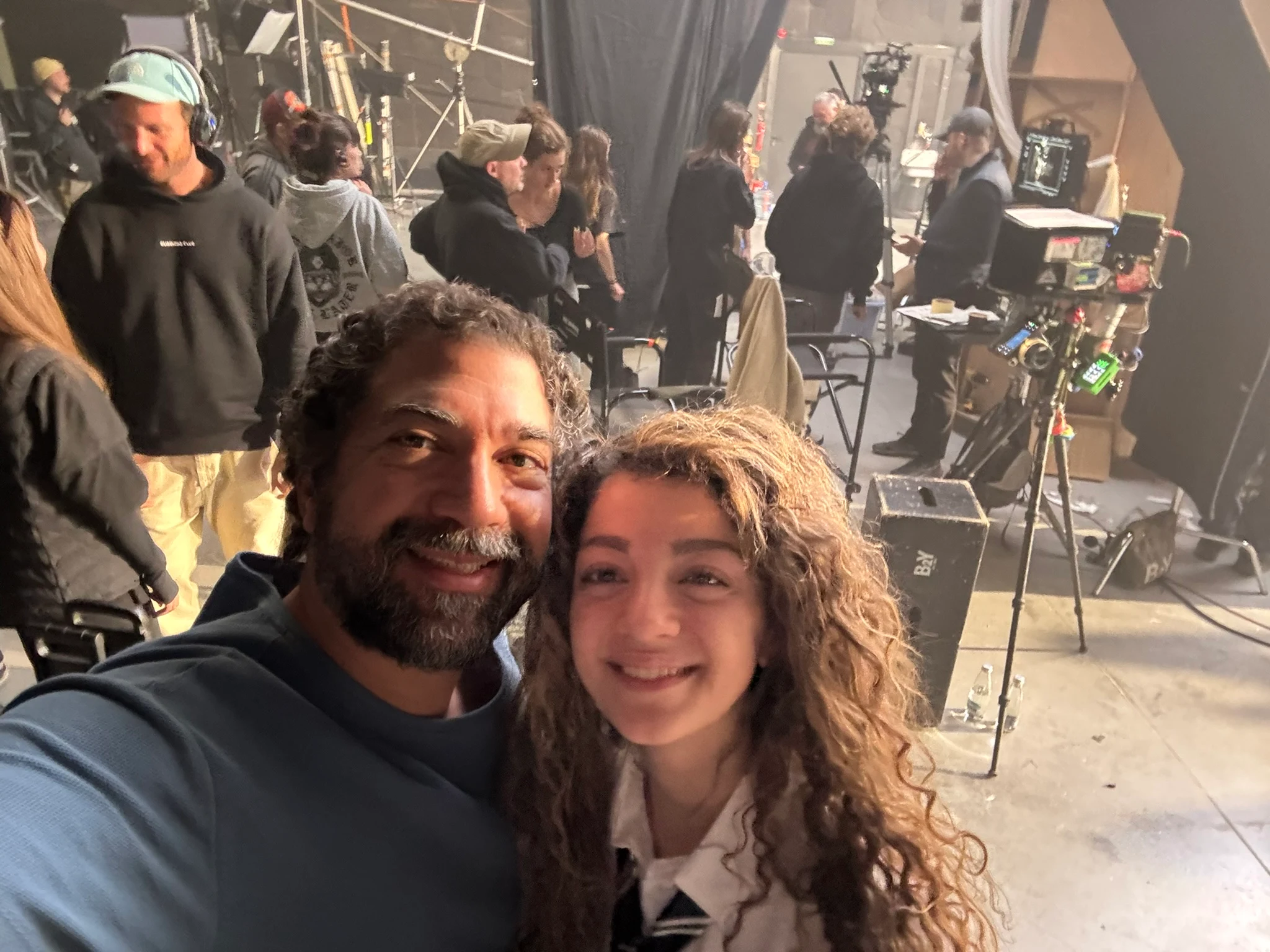 inside film set with Jim Brown in back ground
