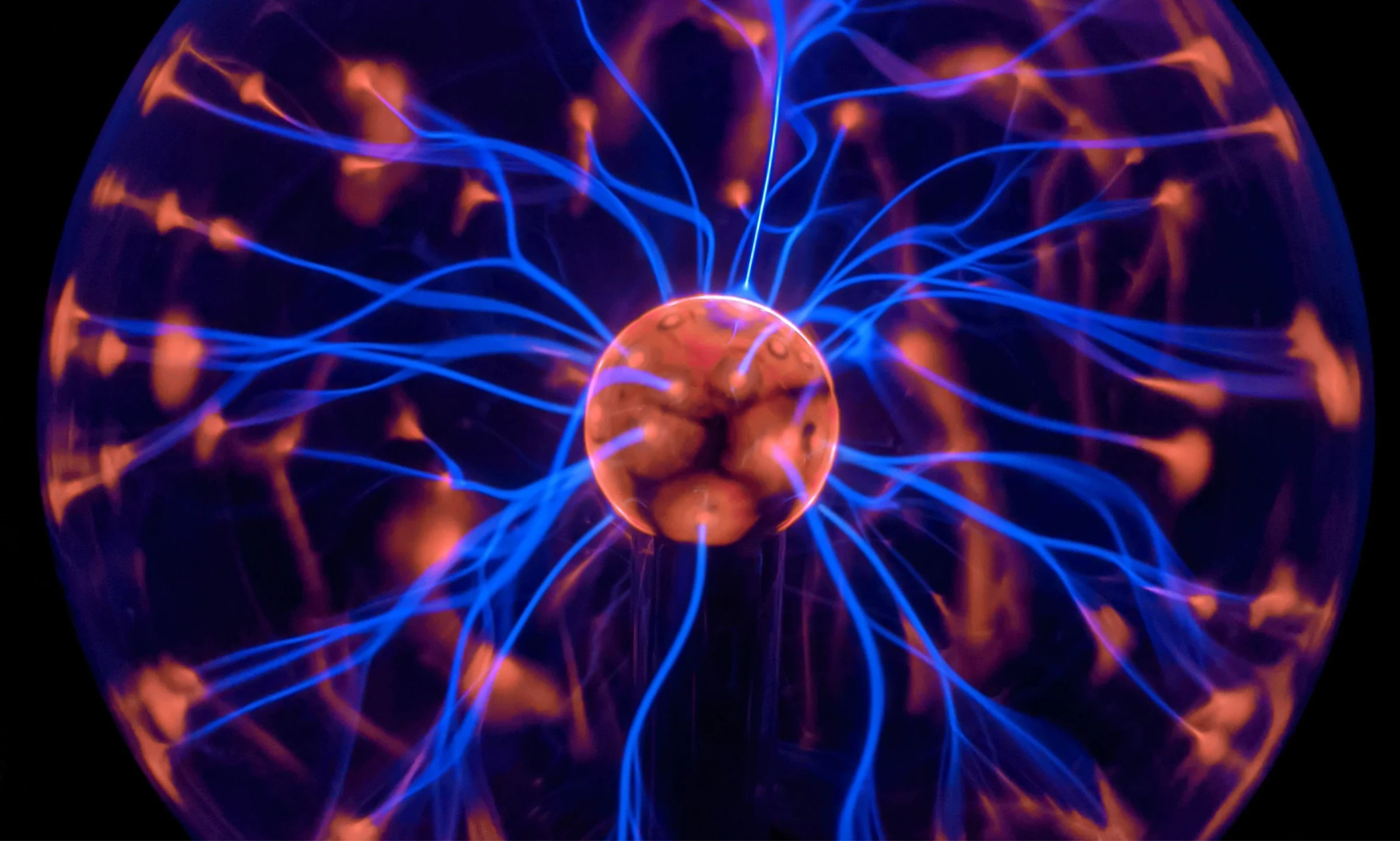 Blue and orange plasma ball with live currents