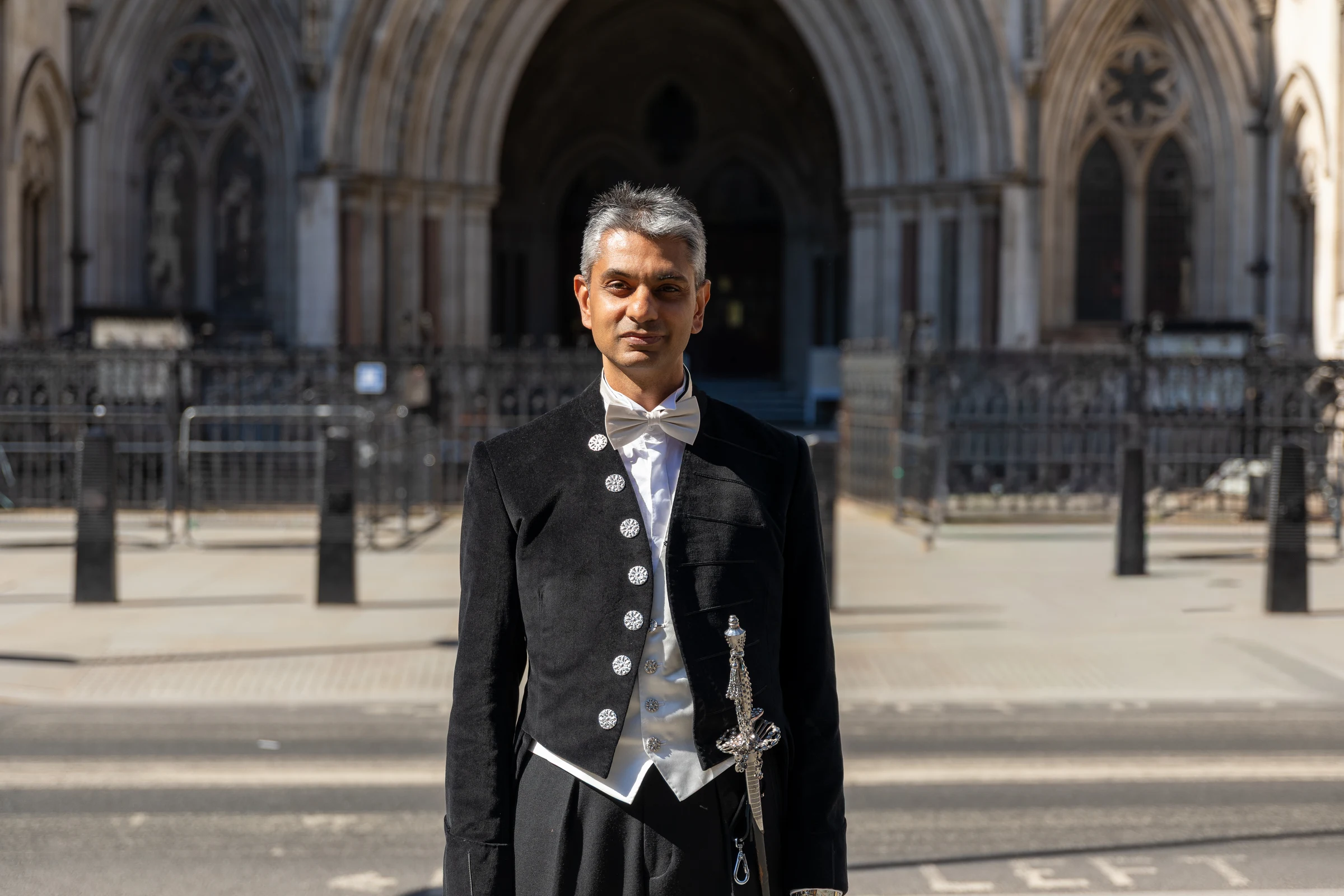The High Sheriff of Greater London, Dhruv Patel CBE in front of the Royal Courts of Justice