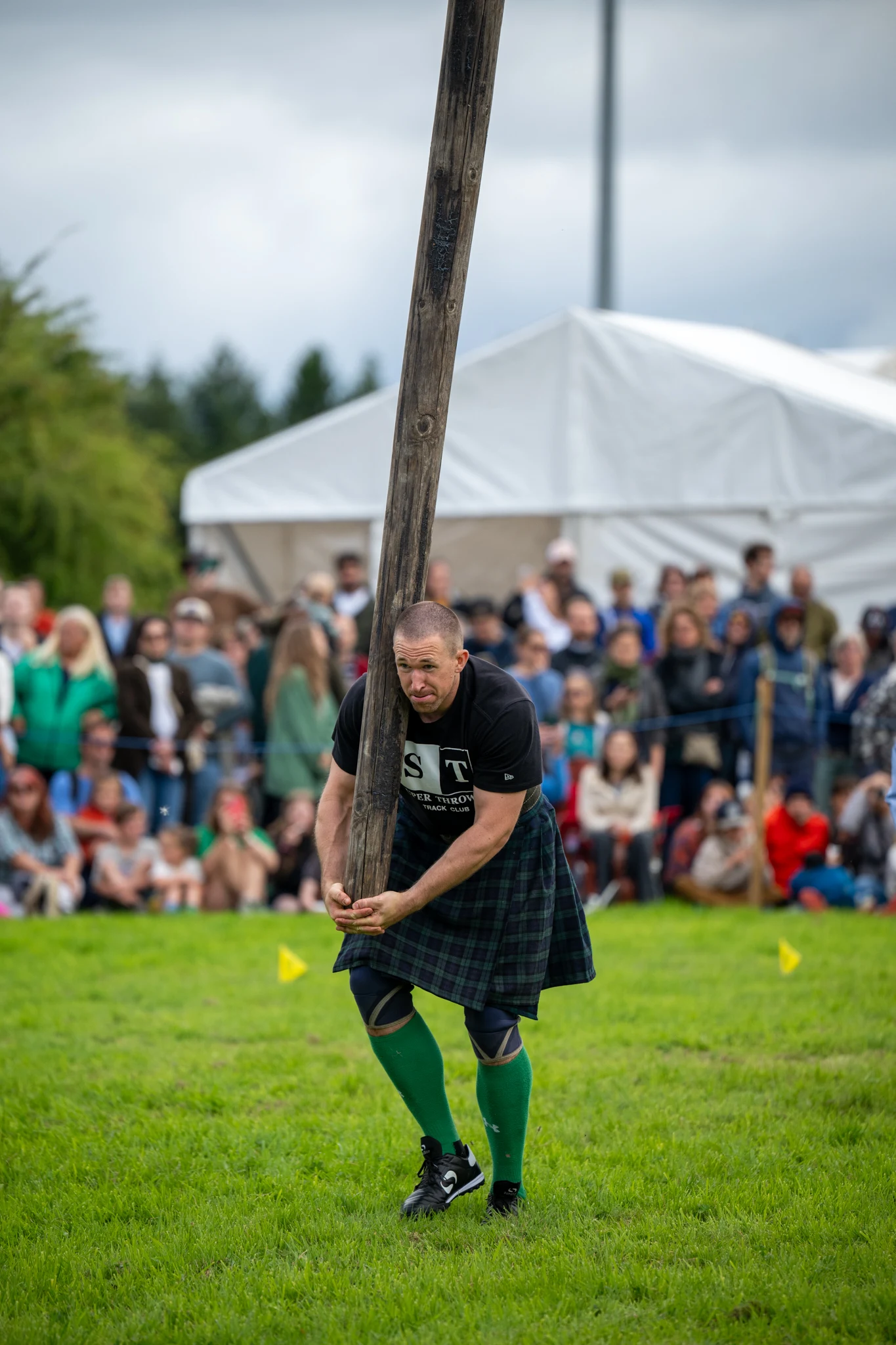 Stirling Highland Games 2026 Champion Aaron Castle tossing the caber - Bryan Robertson Photography