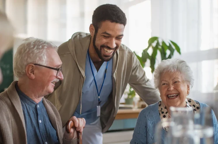 Nurse smiling with care home residents