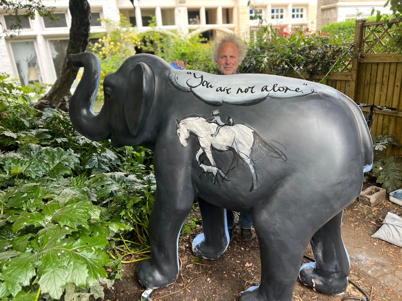 Charlie Mackesy with his hand-painted elephant sculpture Amara