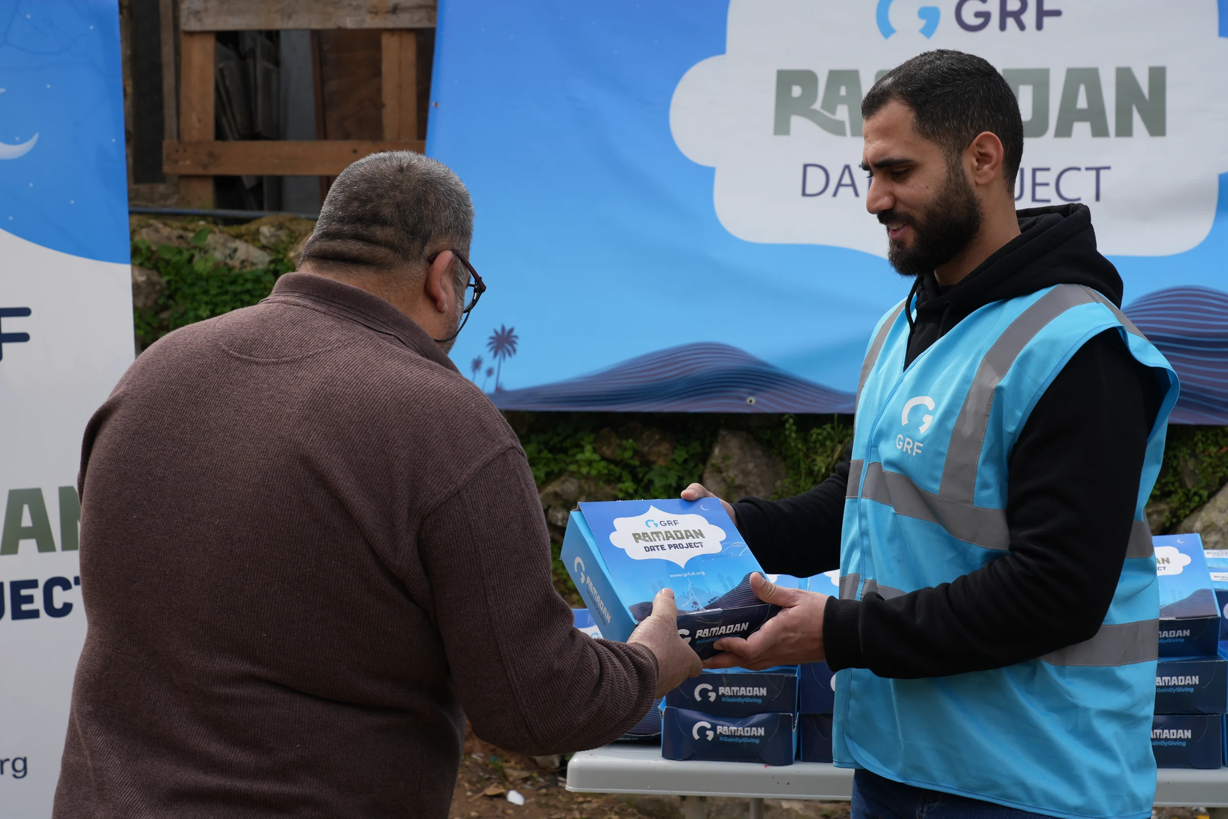 Distributing date boxes for refugee families in Lebanon
