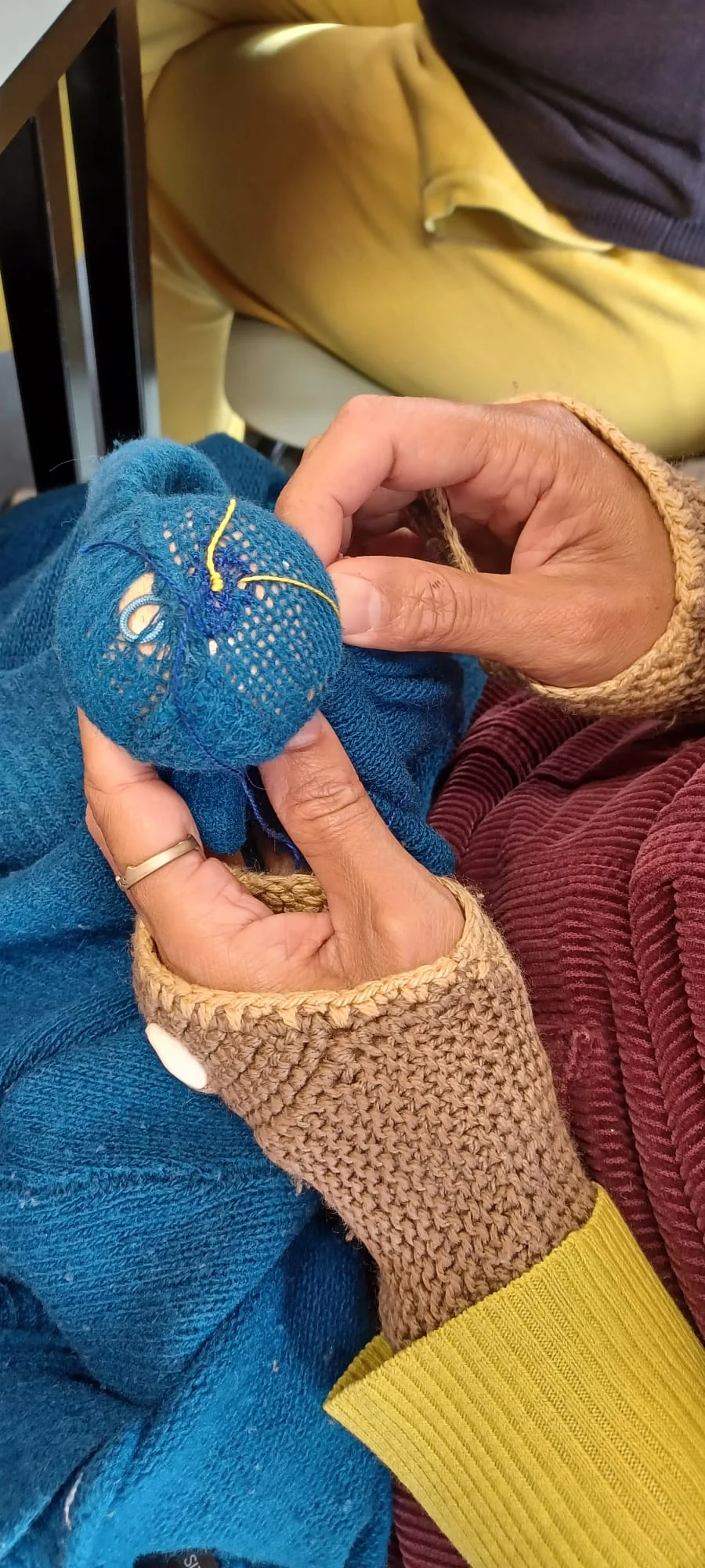 Visible mending of clothes at a Railway Gardens skillshare
