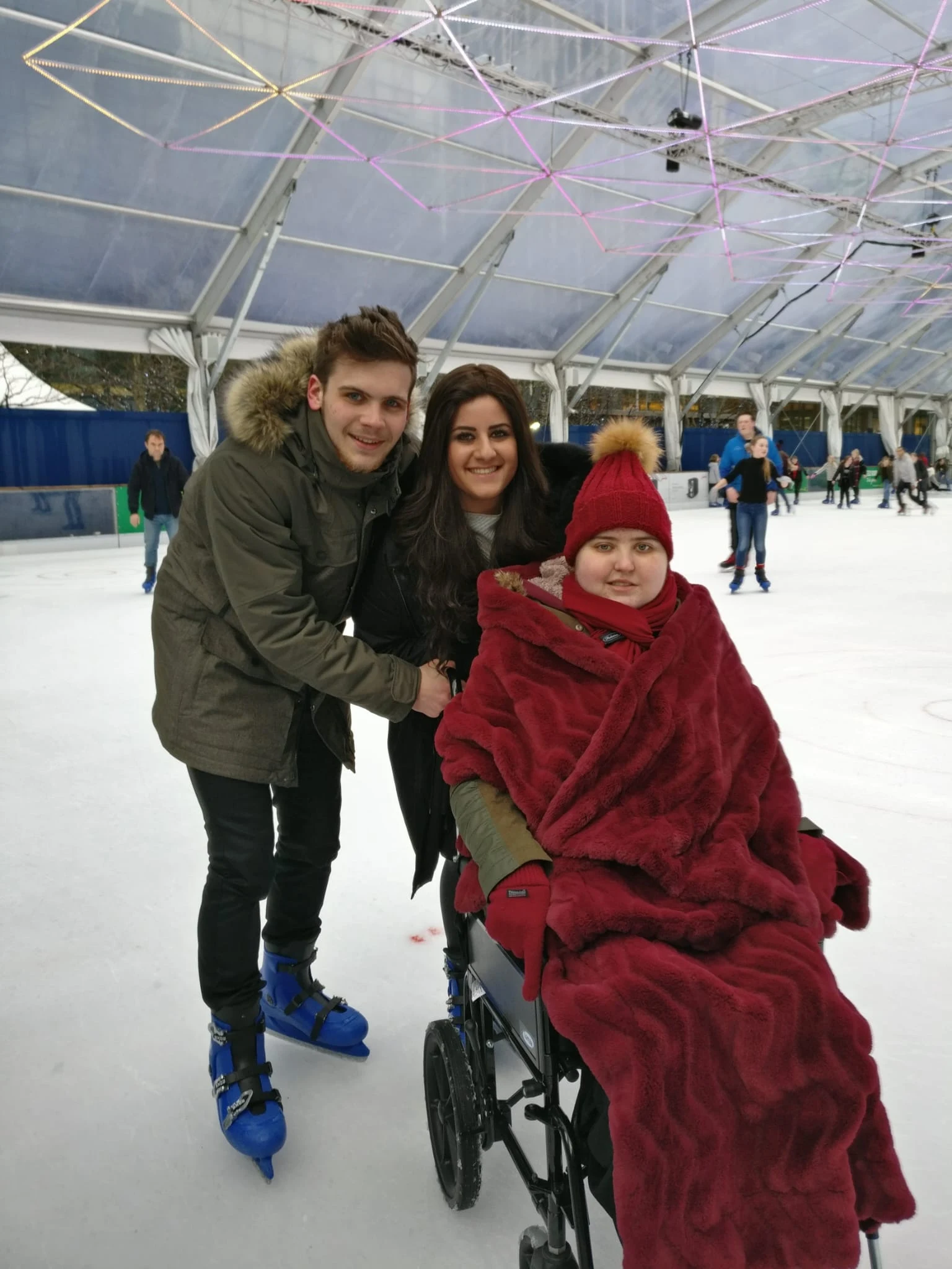 Sarah and her brother taking Rachel ice skating