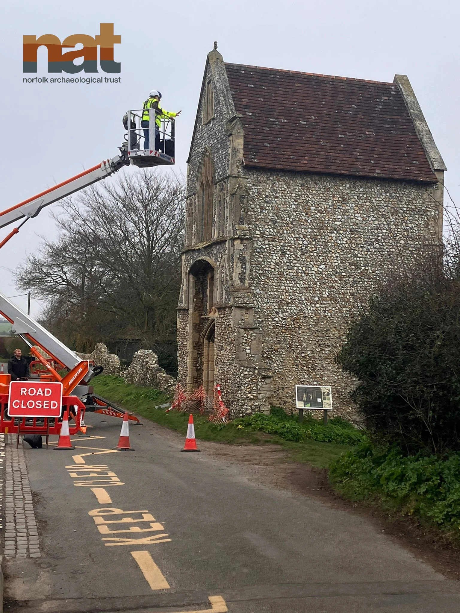 Burnham Norton Friary with cherry picker investigating the condition of the walls