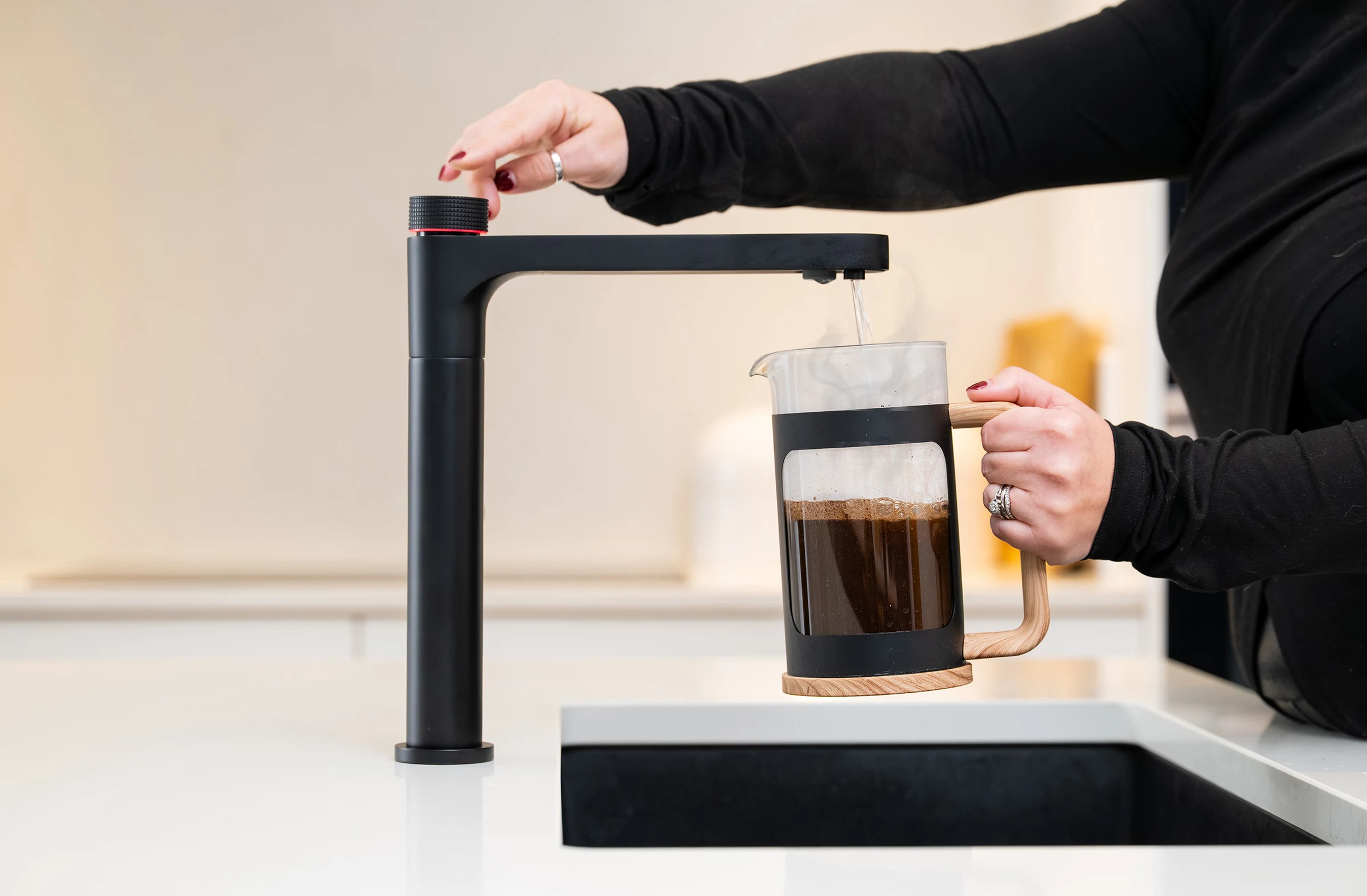 Aquatap Ultimo 6-in-1 boiling water tap in Matt Black finish installed in a modern kitchen
