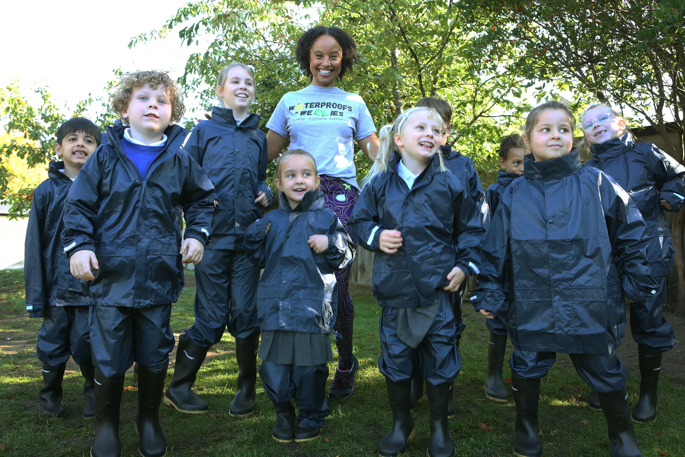 Gemma Hunt helps children unpack their new waterproof clothing and wellies during The Outdoor Guide Foundation’s school visit.