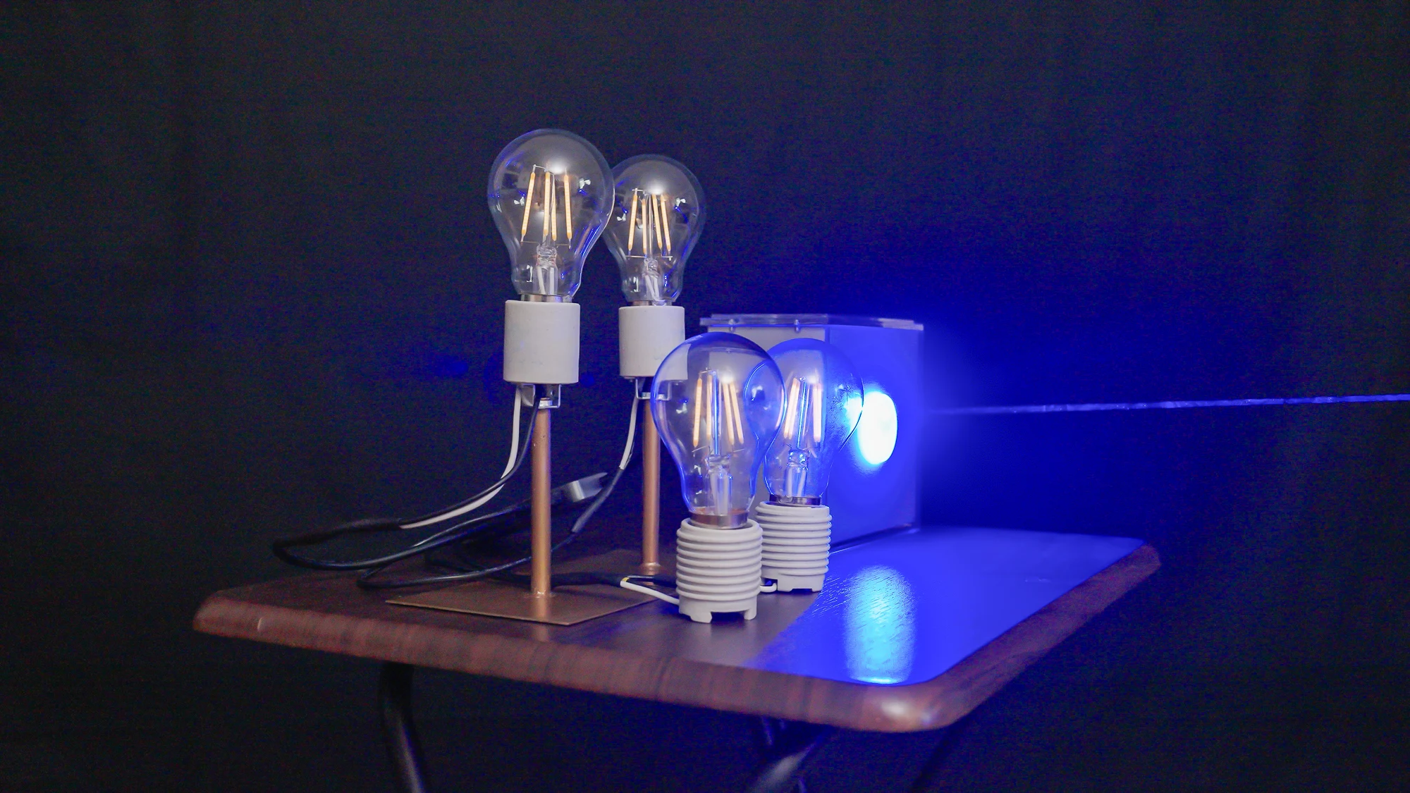 Laser beam powering a few bulbs