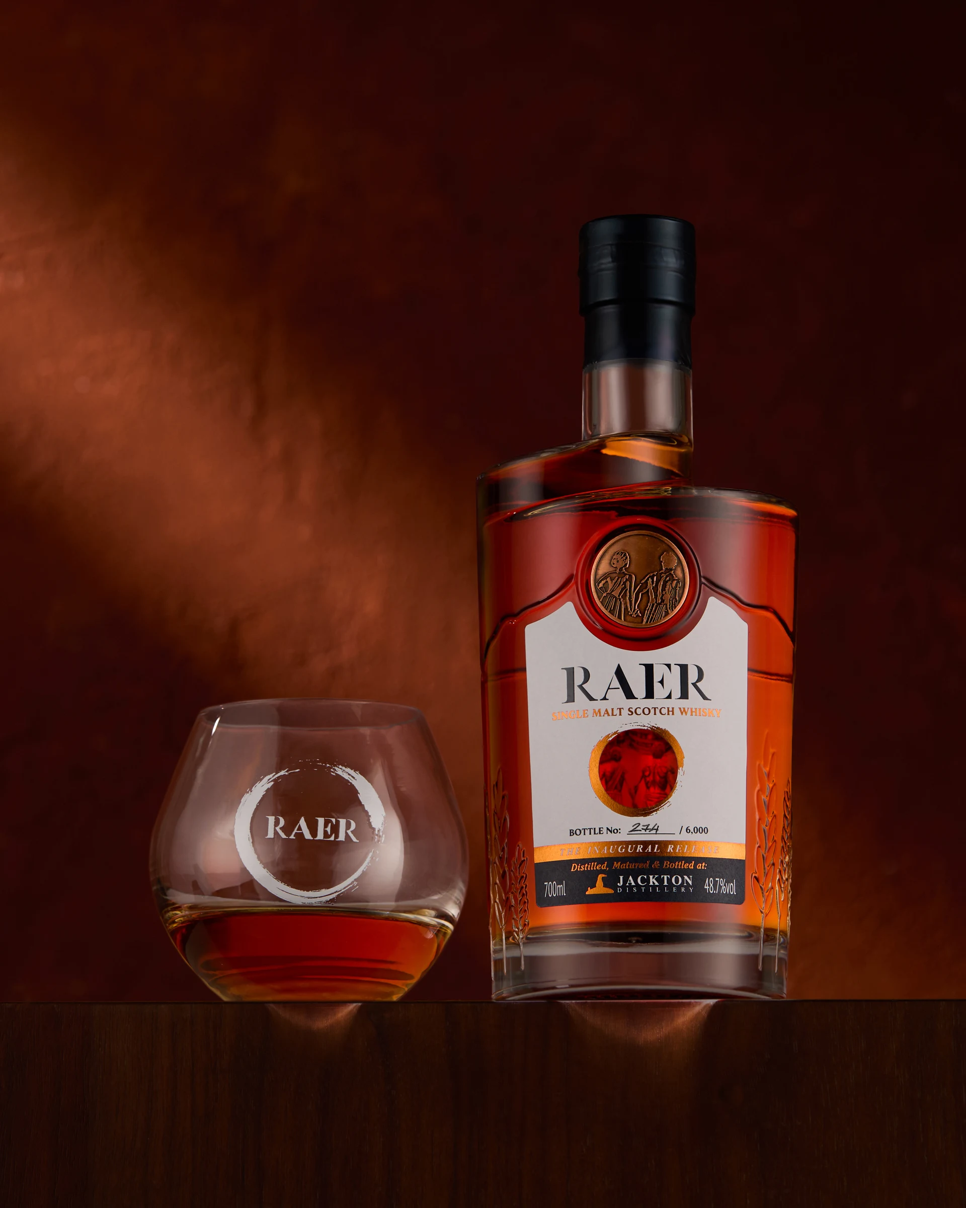 RAER Single Malt - bottle and glass with peep thru on label