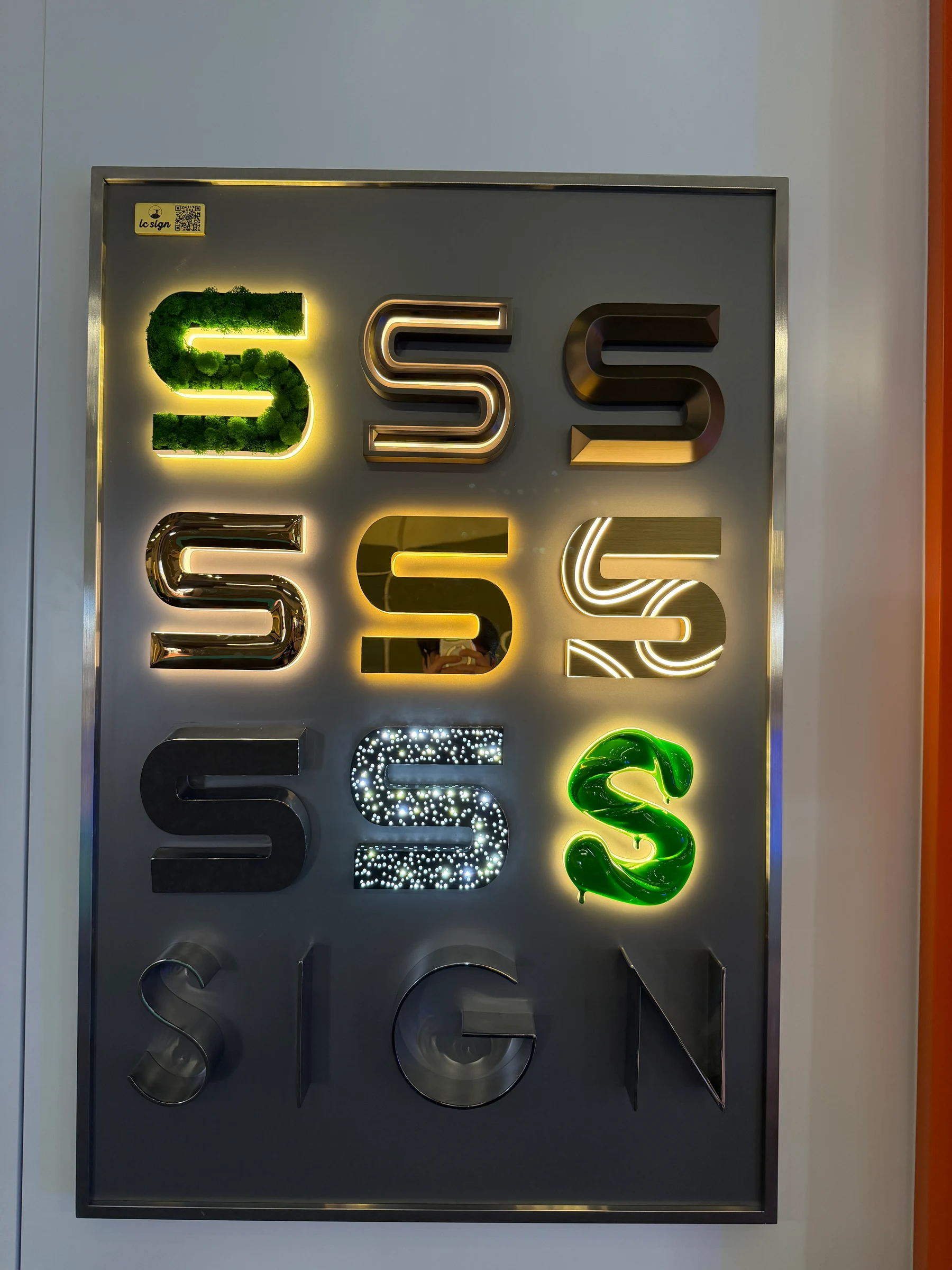 Mirror-finish fabricated signage from LC Sign demonstrating high-end metal fabrication and architectural branding craftsmanship.