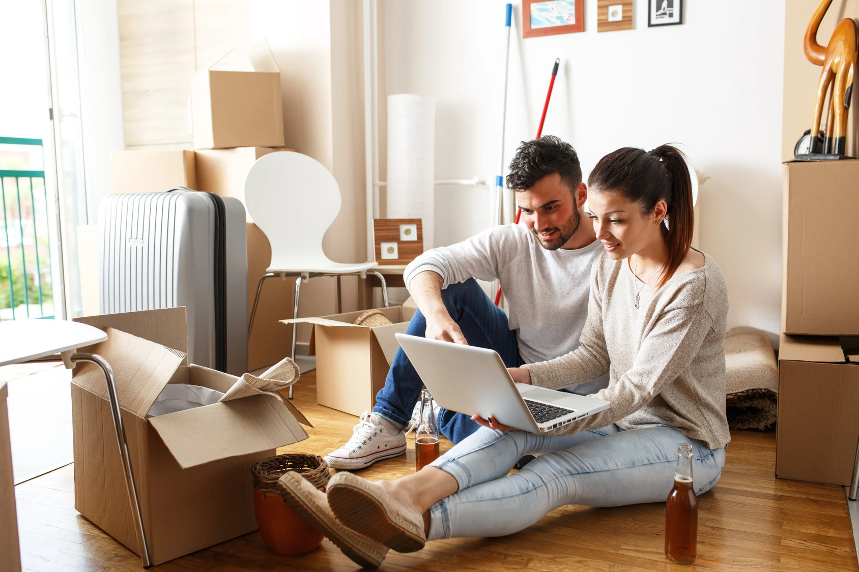 young couple unpacking boxes