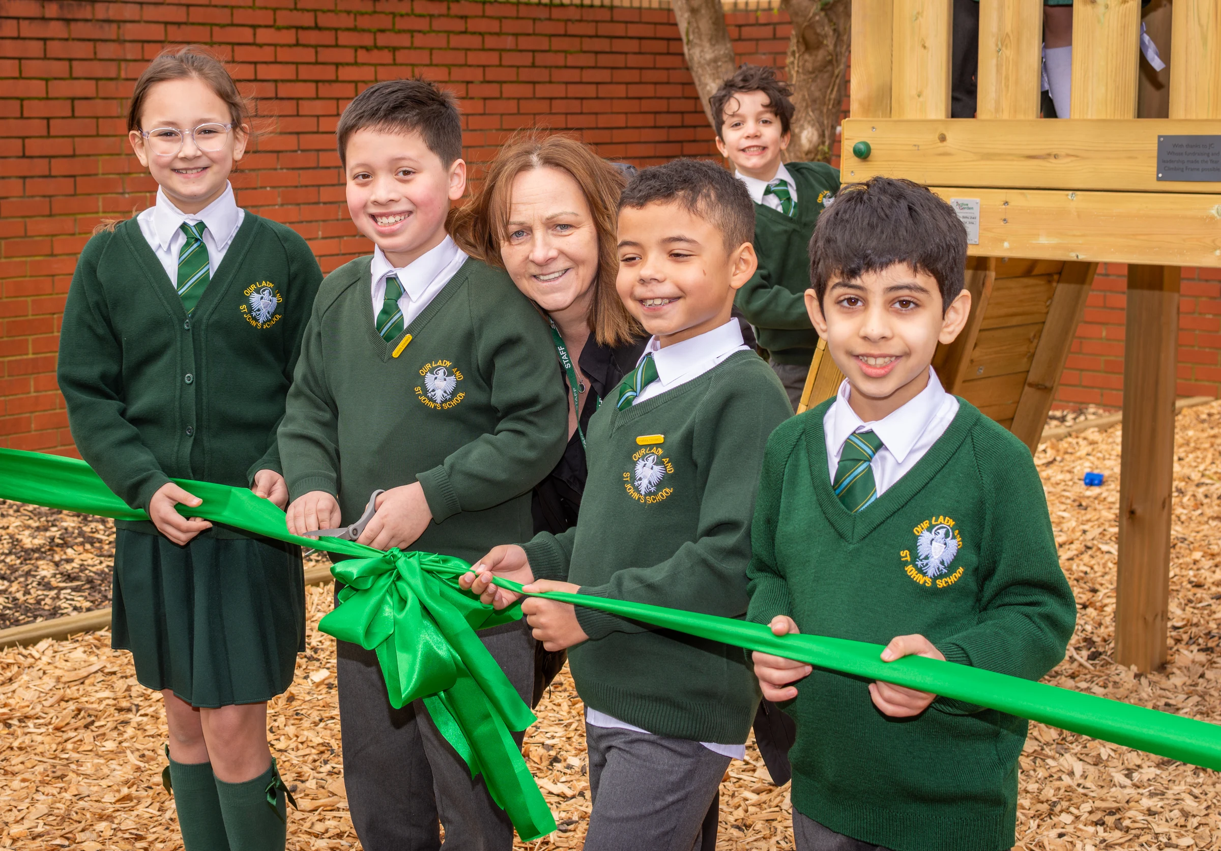Cutting the ribbon ONE Wanda (right), JC Mrs Sheehan, Vinnie, Kian (left)