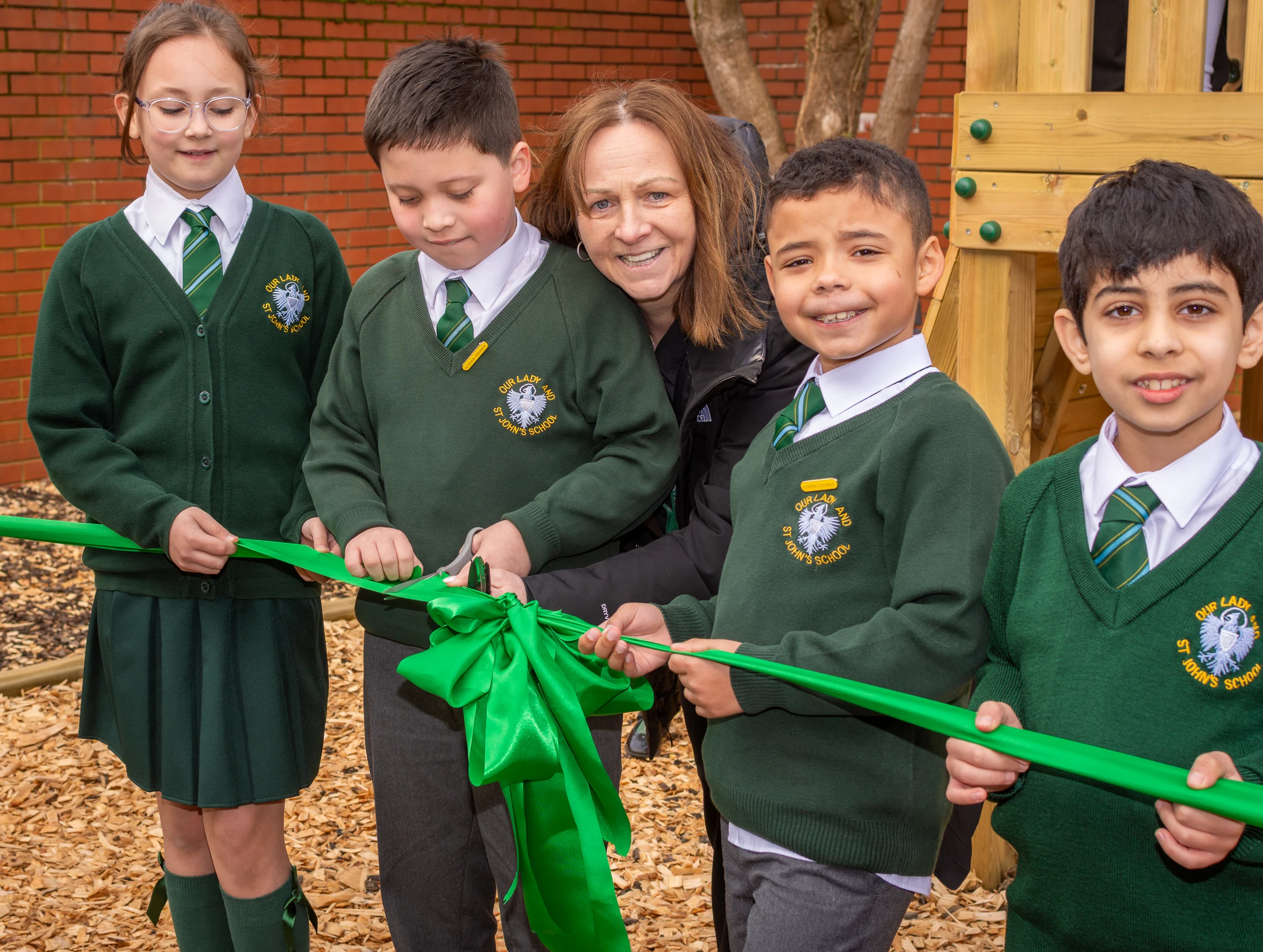 Cutting the ribbon TWO Wanda (right), JC Mrs Sheehan, Vinnie, Kian (left)
