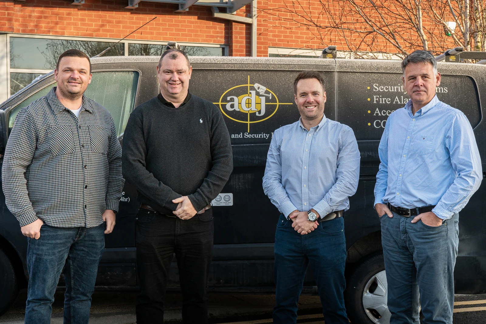 APG team outside of the ADJ offices located in Bolton