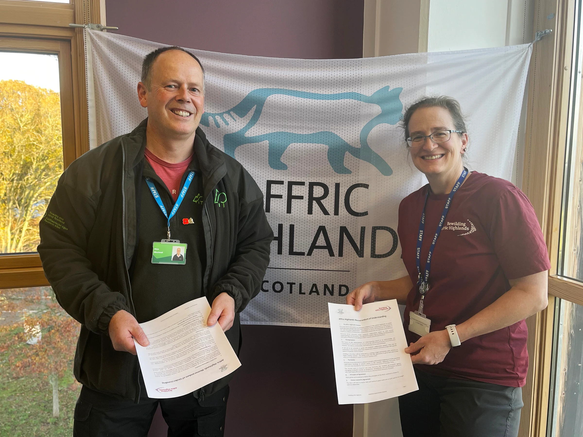 Stephanie Kiel (Rewilding Affric Highlands) and Alex Macleod (Forestry and Land Scotland) with signed MoU - copyright Amy Clarkson
