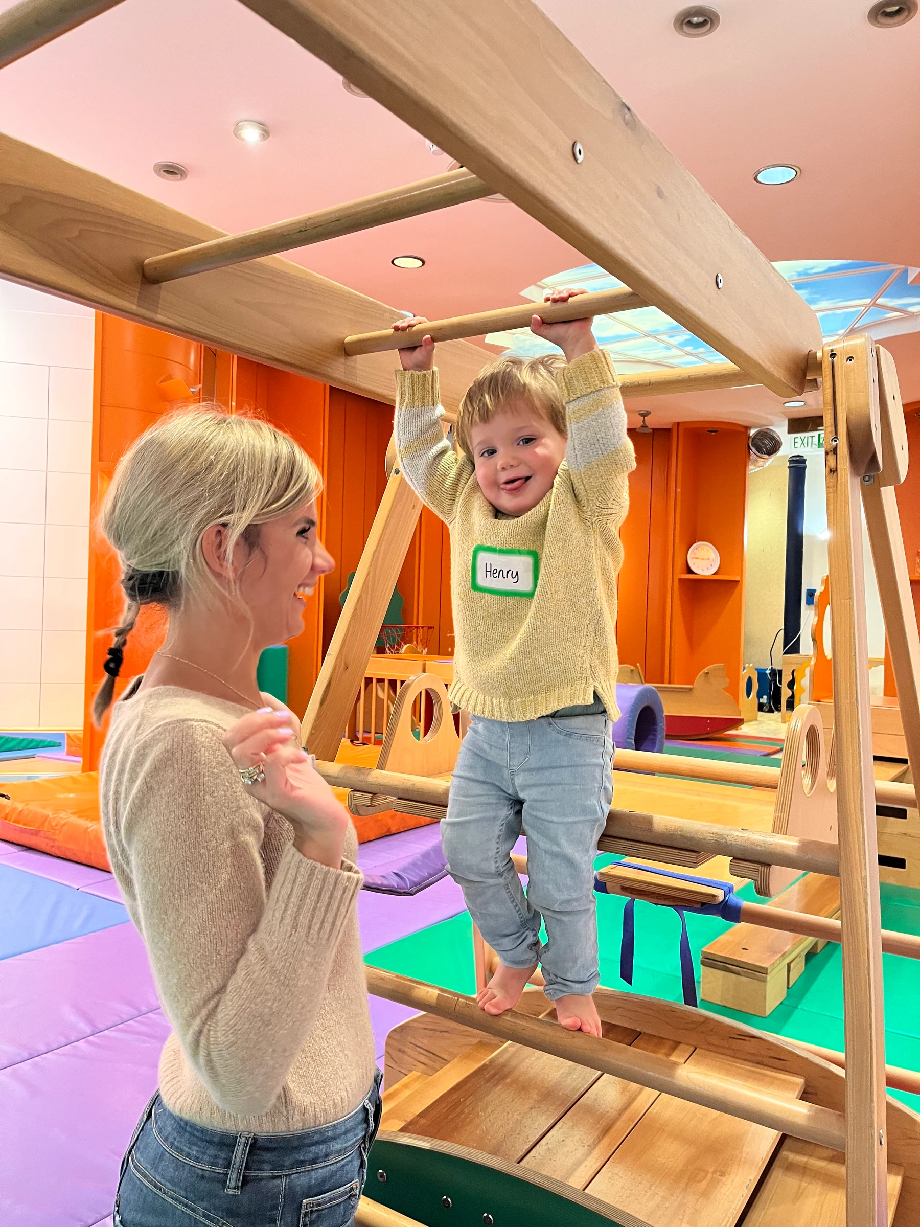 Toddler playing on the equipment in a Gymboree Play & Music class